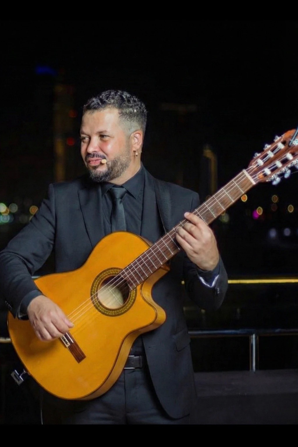 TITO performing Spanish guitar in an elegant private event setting